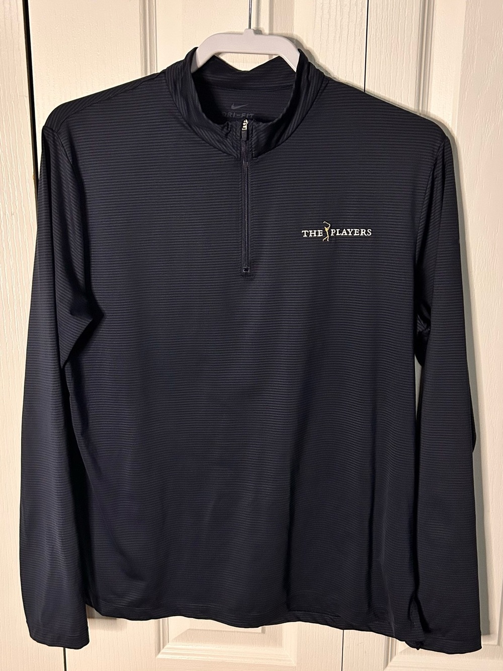 The Players Nike Women’s Large 
Dri-Fit Navy Blue Stripped Quarter-Zip Pullover